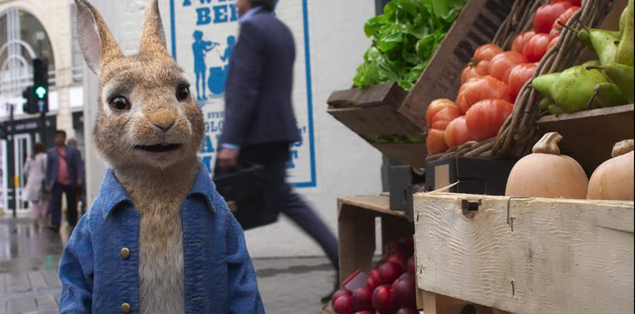 Peter at a vegetable stand in the city in Peter Rabbit 2 